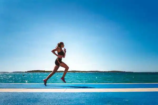 Woman running showing strong leg muscle Stroud